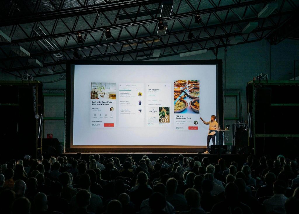 Confident man pointing to his presentation in his speech