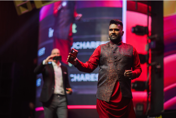 Emcee, host, moderator Dan Ram onstage at an event